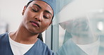 Tired, woman or surgeon with stress on glass window for medical failure, mistake or bad procedure. Exhausted, female person or nurse with reflection or fatigue for surgical crisis or loss in hospital
