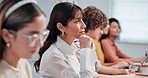 Listening, presentation and teacher with students in college for notes, feedback and lesson. University, class and people with books, tech and writing for education, learning and oral assignment