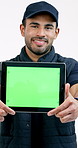 Logistics, tablet and happy man with green screen, mockup and delivery monitoring in ux design. Distribution, face and courier with chroma key, order track and shipment progress on studio background.