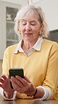 Digital, scroll and senior woman with phone, online communication and notification on chat app. Contact, happy and elderly person with tech, message update and internet browse on virtual platform.
