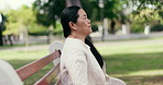 Mindfulness, outdoor and senior woman on break, contemplating or smile with stress relief in nature. Calm, breathing and retired Asian person on peaceful holiday, happiness and thinking at park