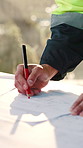 Person, engineer or hands on blueprint for drawing, planning renovation or expansion project. Floorplan, draft and architect at site for property development, marking design or structure instruction