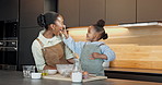Mom, child or laughing with flour nose in kitchen for fun baking or bonding together in home. Mother, kid or playful daughter with humor, comedy or joke for dessert recipe, ingredient or culinary art