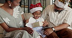 Christmas, gift or black family with child in home for festive celebration, bonding or weekend. Mom, dad or daughter with present or smile for December holiday, new year or surprise together in house