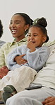 Smile, parents and child at house with television, streaming and latest cartoon for bonding. African family, laugh and toddler in lounge with tv show, comedy movies and animation video for childcare