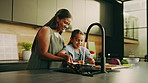 Mom, kitchen or cleaning food with child for hygiene, washing vegetables or meal prep together. Mother, kid or daughter rinsing ingredients with tap water for dirt, germ or bacteria removal in home