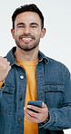 Phone, face and happy man with fist pump for winning or achievement on a white studio background. Portrait, male person or smile with technology or celebration for success, good news or discount app