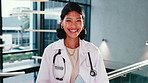 Face, woman and happy doctor in hospital for healthcare, wellness service or laugh with career pride. Portrait, physician and female person with smile, trustworthy and medical employee with tech