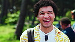 Face, student and laughing on campus for academic development, future and education with man outdoor. Happy, portrait and person with backpack in park, educational opportunity and college for growth