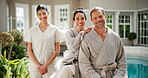 Face, masseuse and couple at spa with smile, beauty and assistance for wellness service on holiday. Portrait, people and employee at resort with confidence, pamper experience and luxury hospitality 