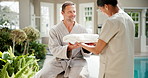 Masseuse, spa and happy man with towel in luxury resort for accommodation, hospitality or vacation. Male person, massage therapist and fabric with cloth for beauty treatment or relaxation in retreat