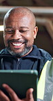 Construction worker, laugh and man with tablet on building site, inspection or research on website. Low angle, mature builder and happy black person with tech, update and property development on app