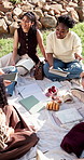 University, discussion or friends outdoor with picnic, friendly chat or planning of group project. Happy, people or students with bonding, peer connection or team update on college assignment.