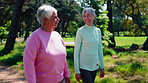 Outdoor, old people and friends walk for fitness with longevity advice, conversation and health. Active retirement, exercise lifestyle and happy women at park for talking, story and wellness benefits
