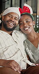 Couple, face and laughing in home, Christmas and bonding with partner on December holiday in lounge. Portrait, black people and connection with spouse, Xmas and happy for festive season in house