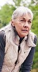 Fitness, senior and woman with break in nature for breathing, workout recovery or outdoor rest. Active, elderly or female person catching breathe for physical exercise, health or wellness in park