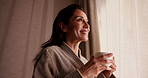 Happy, coffee and woman by window at hotel for break on vacation, holiday and thinking in morning. Travel, reflection and person with drink, relax and view for accommodation, hospitality and getaway