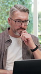 Laptop, thinking and man in office with creative insight, magazine publication or story development. Tech, mature person and editor with idea for article revision, narrative planning or reading