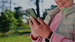 Hands, phone and old person outdoor with digital app for social media, connection and communication. Female user, senior platform and online subscription for mental stimulation or navigation at park