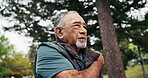 Hiking, break or old man in nature with shoulder pain, joint injury or burnout in fitness activity. Discomfort, tension or senior person with ache, wellness risk or arm strain in retirement trekking.