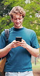 Walking, phone and man outdoor at college for social media, chat and travel to class for education. Happy, university and student on cellphone for internet, website and message for learning or study