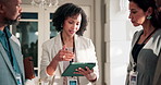 Tablet, leader and team with business woman at conference for vip organizer, meeting and advice. Delegate registration, digital guest sign in and seminar coordinator with employee in hotel for search