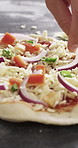 Cooking, pizza and hands of chef with spring onion in restaurant for catering with dough for meal. Ingredients, vegetables and culinary worker with food production for Italian cuisine in kitchen.