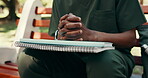 Student, hands and nervous with books outdoor, waiting or anticipation for exam results at university. Person, anxiety or awaiting scholarship news, test outcome or college pressure with textbooks