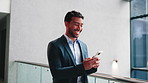 Walking, office and business man with phone for message, investment update and email communication. Corporate, finance and happy person on cellphone for website, connection and online chat in lobby
