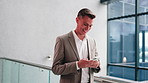 Walking, happy and businessman with phone in office for message, investment update and communication. Corporate, finance and person on cellphone for website, connection and online email in lobby