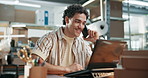 Man, owner and phone call at startup with laptop, discussion and contact supplier for delivery. Smile, male person and talking in warehouse with tech, wholesale inquiry and update pricing of shipping