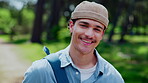Face, student and happy on campus for education, future and academic development with man outdoor. Laugh, portrait and person with backpack in park, educational opportunity and college for growth