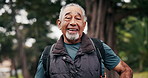 Face, smile and old man hiking in nature with fitness, travel and fresh air for retirement wellness. Bokeh, happy senior person and journey outdoor in forest with trekking, vitality and good mood.