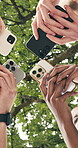 Low angle, hands and students with phones for connection, data sync and laughing together outdoor. Circle, huddle and happy people on campus with mobile app, college community chat or learning forum