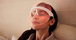 Beauty, woman and mask for red light with skincare, boost collagen or anti aging benefits in bedroom. Mature person, relax and infrared LED for facial treatment, biohacking therapy and glow in home