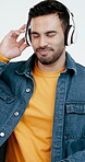 Dance, happy and man in studio with headphones, song connection and listening to music playlist. Smile, groove movement and person with tech, feeling beat and radio streaming on white background.