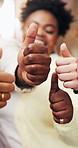 People, student and hands with thumbs up in university for education, success or review together. Happy, group or friends with smile, like emoji or yes sign for academic achievement or feedback
