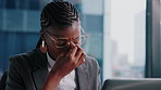 Businesswoman, headache and glasses in office with laptop,  burnout and fatigue with data analysis. Tired, black person and migraine in workplace with computer, spectacles and analyst with stress.