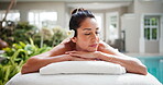 Woman, sleeping and relax in spa with peace, comfort and rest on towel for stress relief at resort. Smile, client and mature person on wellness retreat for skincare, self care and bed at luxury hotel