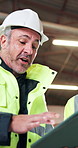 Engineer, discussion and man with tablet on building site, project update and research on website. Low angle, team and happy mature person with tech, construction and plan for property development