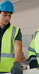 Construction, man and team with blueprint for building design, planning or architecture project. Male person, technician or discussion with architect or floor layout for brainstorming ideas together