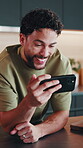 Man, laugh and phone in home for social media, funny video and streaming with networking app. Male person, happy and mobile in kitchen with viral meme, comedy platform and connectivity in house
