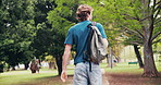 Back, man and student at campus for education, new semester and scholarship for studying abroad. Male person, walk or admission at park for exchange program, academic bursary and learning opportunity