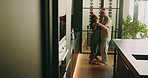 Christmas, dancing and happy couple in kitchen for music, festive celebration or weekend in home. Man, woman or cleaning with vibe or energy for fun December holiday preparation together in house