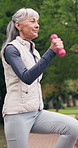 Fitness, outdoor and old woman with dumbbells, active and physical activity for wellness or workout. Cardio, movement and happy senior person with exercise equipment, health and training in nature