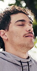 Fitness, man and relax outdoor with deep breath, post exercise and calm nervous system for wellness. Peaceful athlete, person and exhale at park for workout cool down, active practice and fresh air