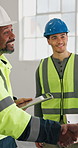 People, engineer and handshake at site with smile, welcome and partnership for architecture project. Happy, team and shaking hands in office with tablet, introduction and agreement on building design