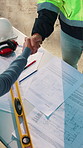 People, handshake and architect with blueprint for planning, project agreement and contract at site. Above, engineer and client with floorplan for shaking hands, business deal or building arrangement