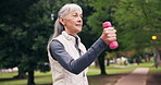 Dumbbells, exercise and old woman in park with walk, cardio workout or training for health longevity. Senior person, weights and marching outdoor with aerobics movement, coordination and fitness.
