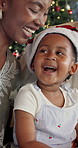 Christmas, child and black family clap for celebration in home for festive holiday, bonding or care. Daughter, parents and together on sofa in house for funny joke, xmas tradition and quality time